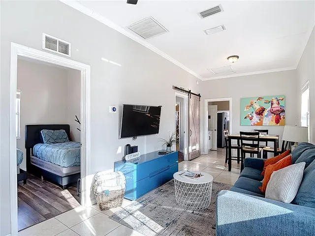 a living room with furniture and a flat screen tv