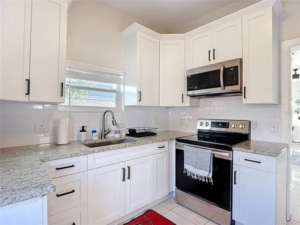a kitchen with a sink and cabinets