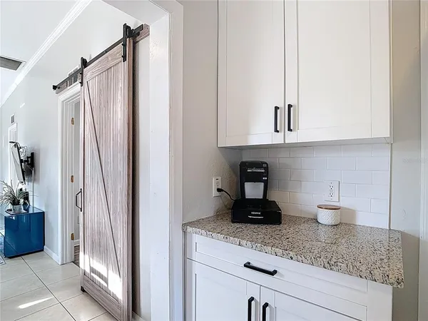 a kitchen with stainless steel appliances granite countertop a refrigerator and a stove