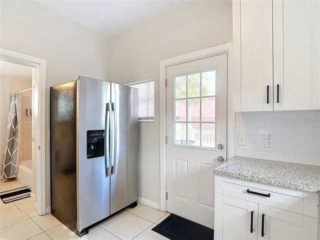 a bedroom with two beds and a window
