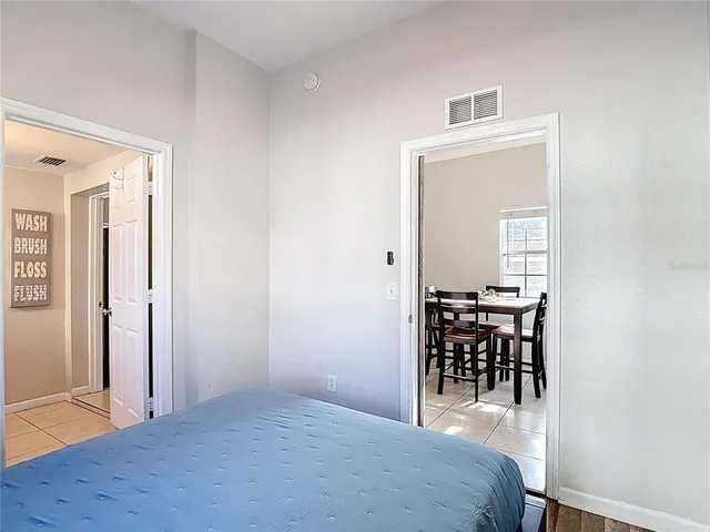 a bedroom with bed and walk in closet