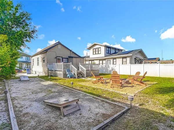 a aerial view of a house with garden space and street view