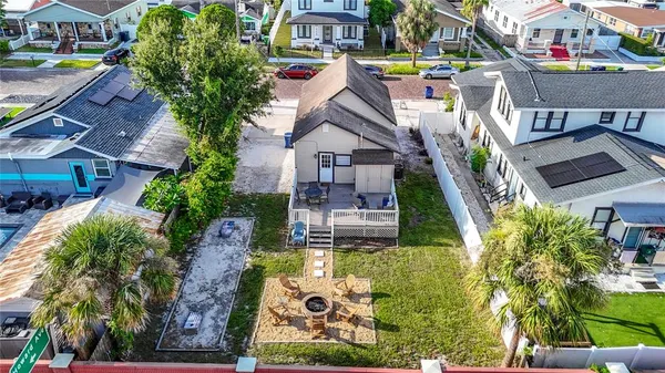 an aerial view of residential houses with city view