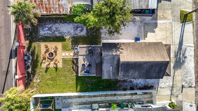 an aerial view of residential houses with city view