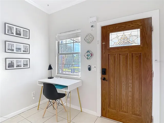 a view of a workspace room with a window