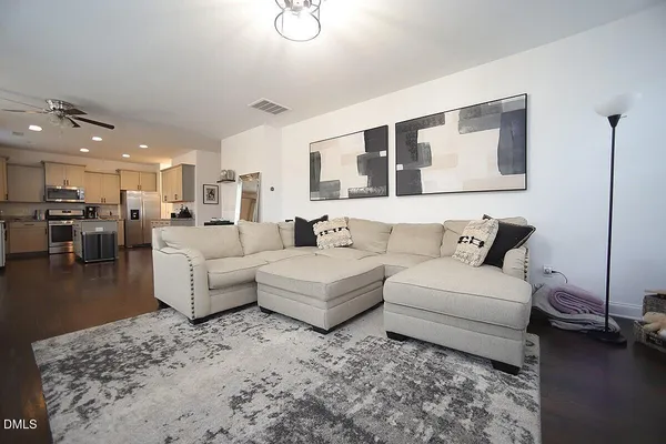 a living room with furniture and a table