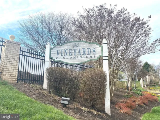 a view of a wooden fence next to a road