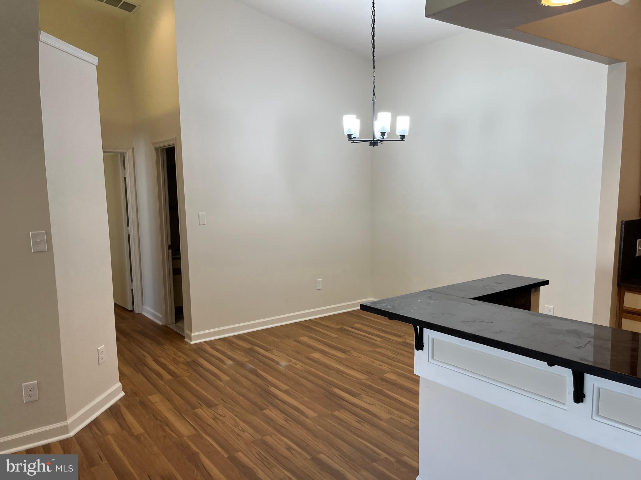 3301 Sir Thomas Drive, Unit 6B41 Silver Spring, MD 20904 - Photo 12 of 54 a view of empty room with wooden floor