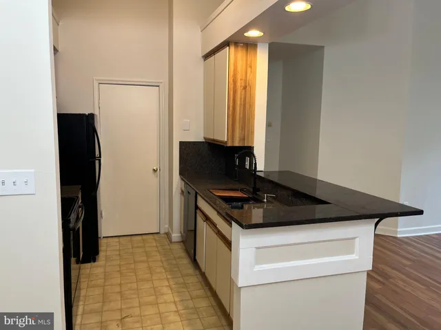 a kitchen with a sink and a window