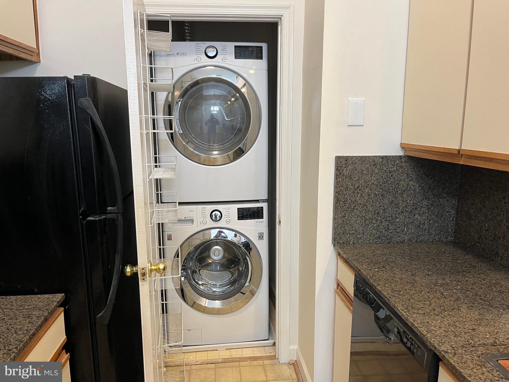 3301 Sir Thomas Drive, Unit 6B41 Silver Spring, MD 20904 - Photo 15 of 54 a utility room with dryer and washer
