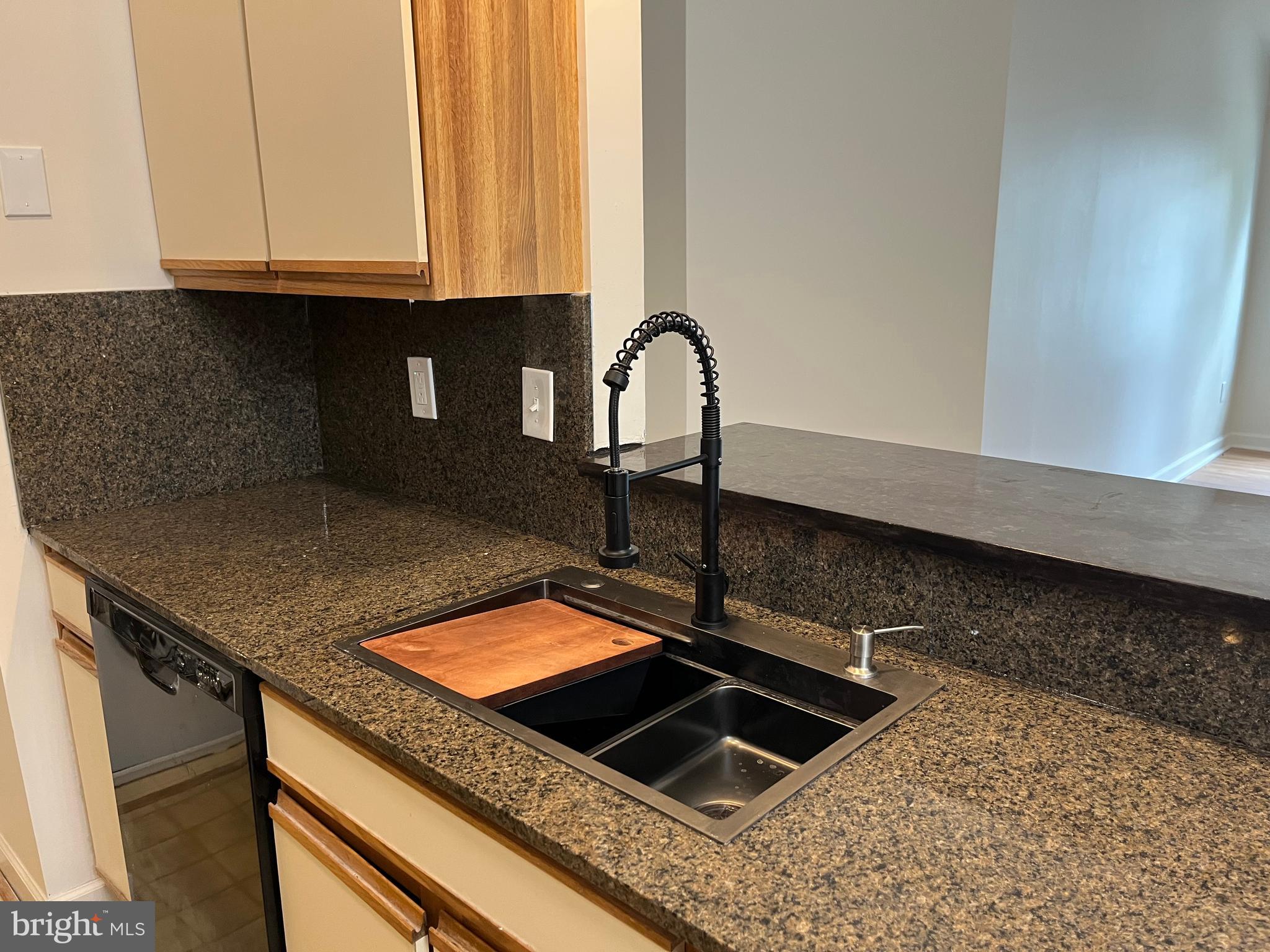 3301 Sir Thomas Drive, Unit 6B41 Silver Spring, MD 20904 - Photo 17 of 54 a kitchen with a sink and cabinets