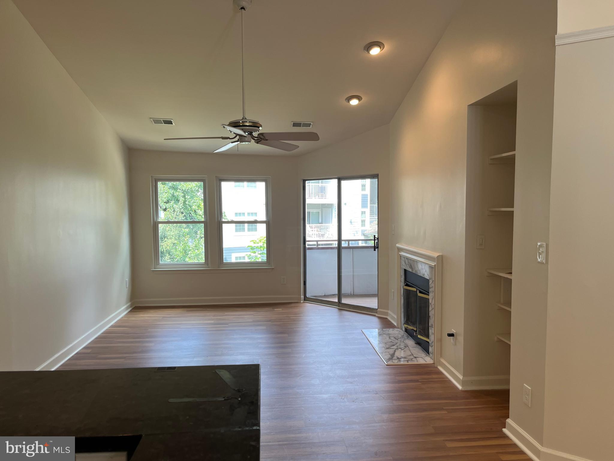 3301 Sir Thomas Drive, Unit 6B41 Silver Spring, MD 20904 - Photo 20 of 54 wooden floor in an empty room with a window