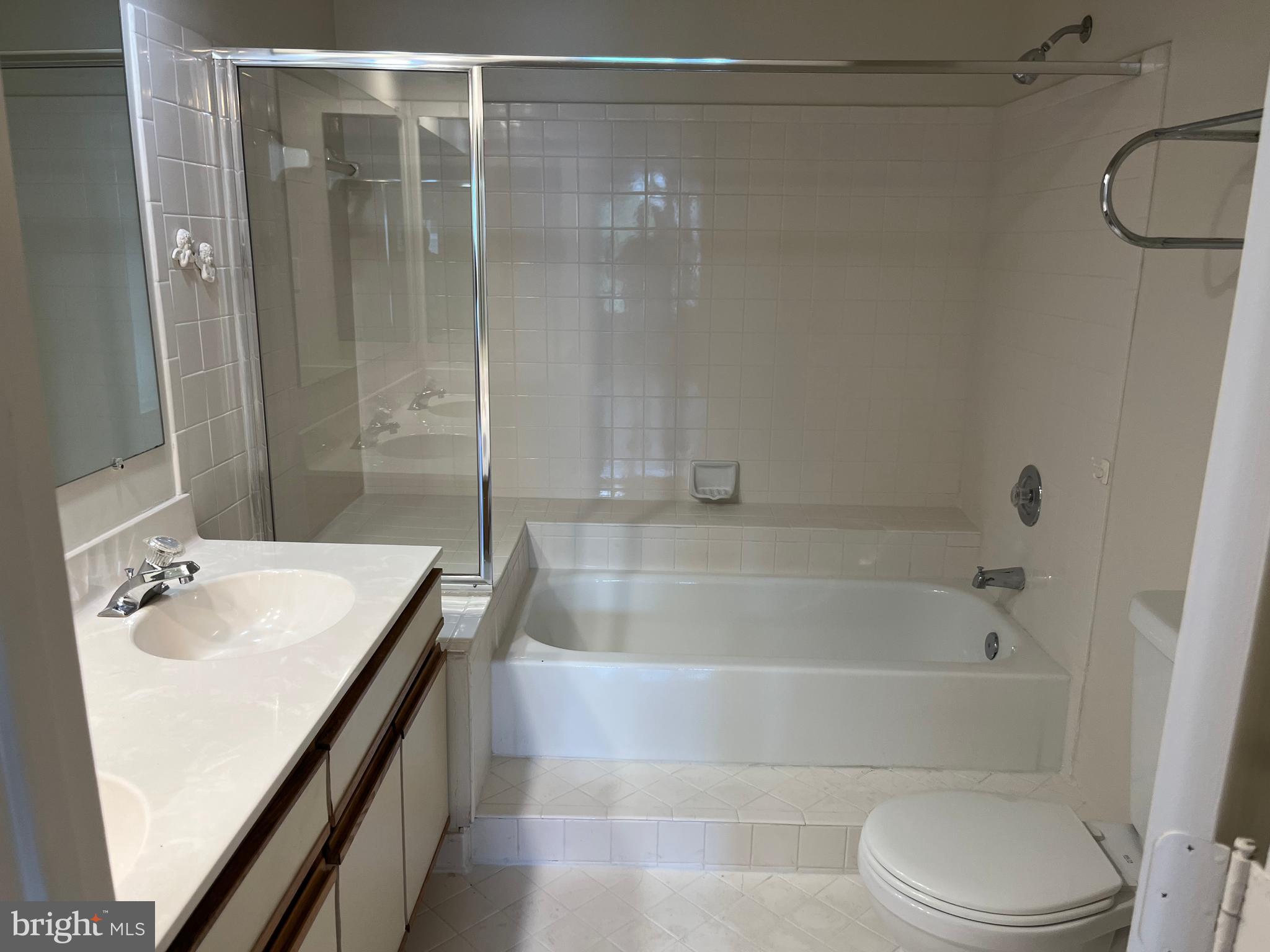 3301 Sir Thomas Drive, Unit 6B41 Silver Spring, MD 20904 - Photo 30 of 54 a bathroom with a shower a bathtub and a sink