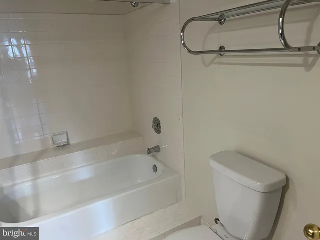a view of a bathroom from a hallway