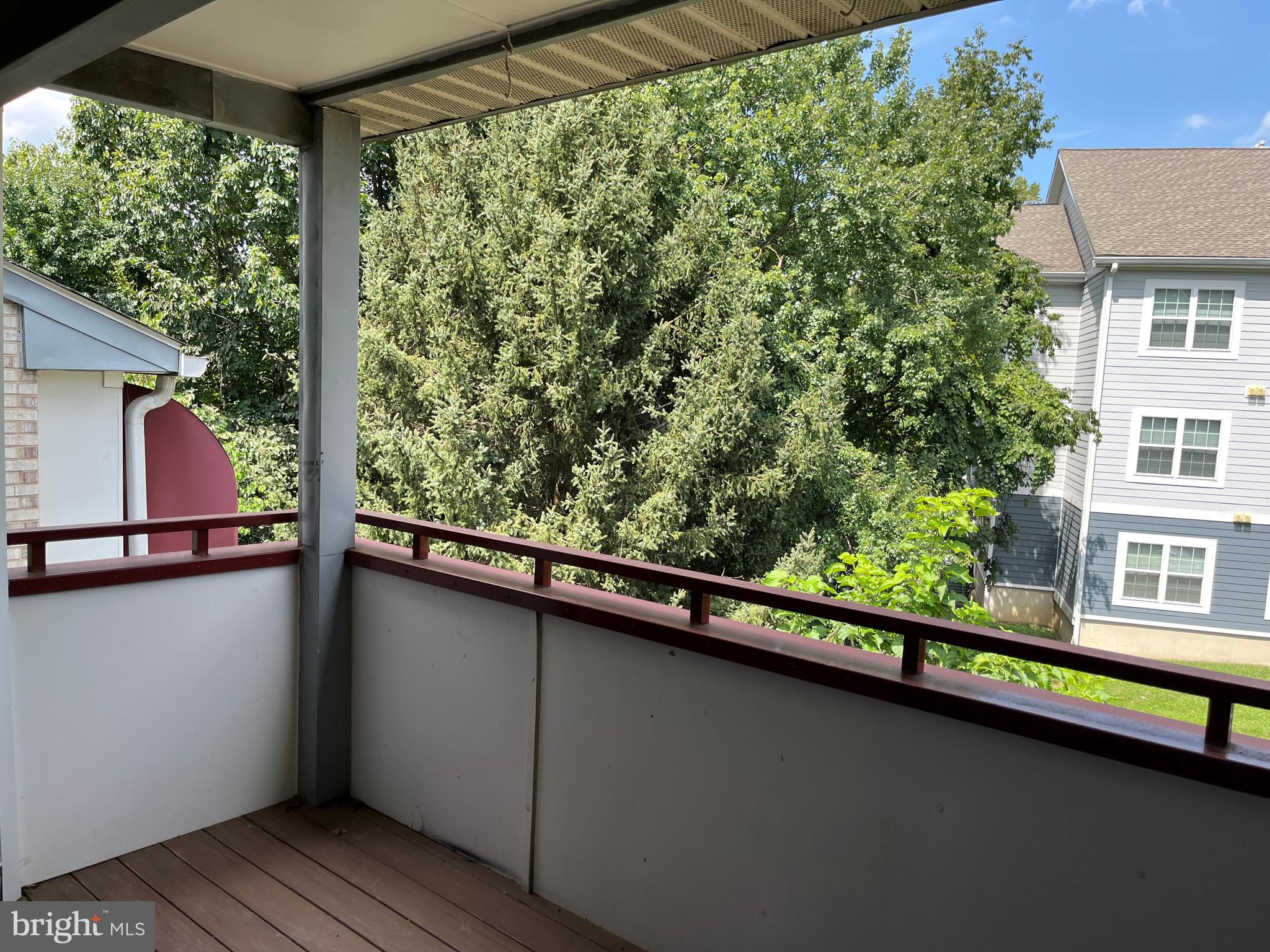 3301 Sir Thomas Drive, Unit 6B41 Silver Spring, MD 20904 - Photo 40 of 54 a view of balcony with wooden floor