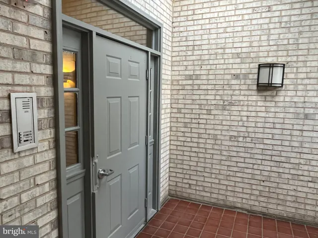a bathroom with a shower and a sink
