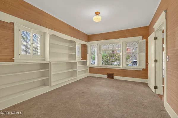 a view of an empty room with a window