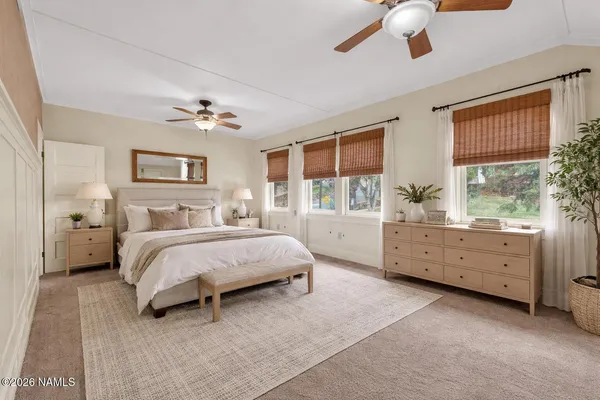 a bed room with a bed and a window