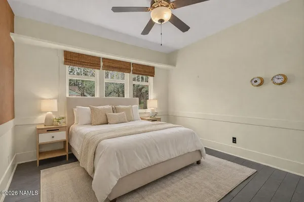 a bedroom with a bed and window