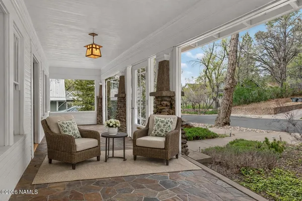 a balcony with furniture and garden