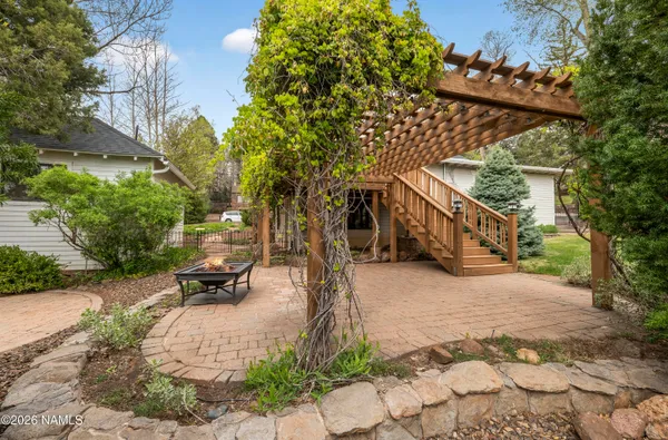 a view of a house with a small yard