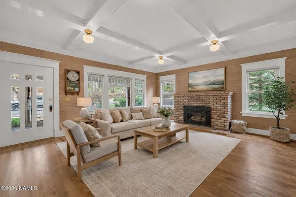 a living room with furniture and a fireplace
