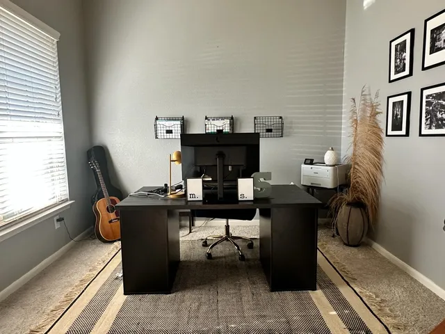 a living room with furniture a rug and a window