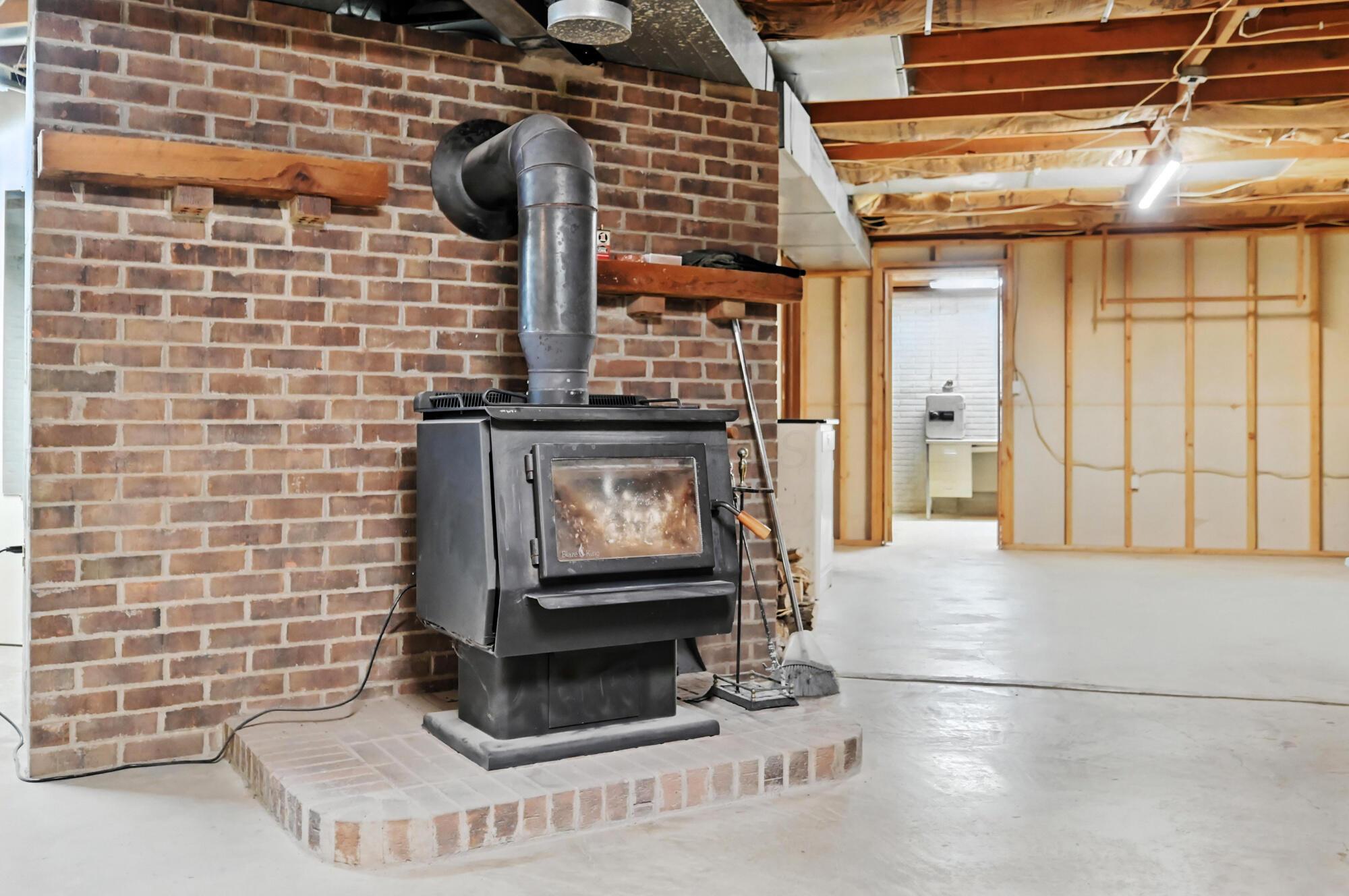 5536 Stauffer Road Morral, OH 43337 - Photo 37 of 56 WOODBURNING STOVE IN BASEMENT