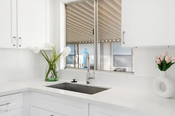 a kitchen with a sink and a window