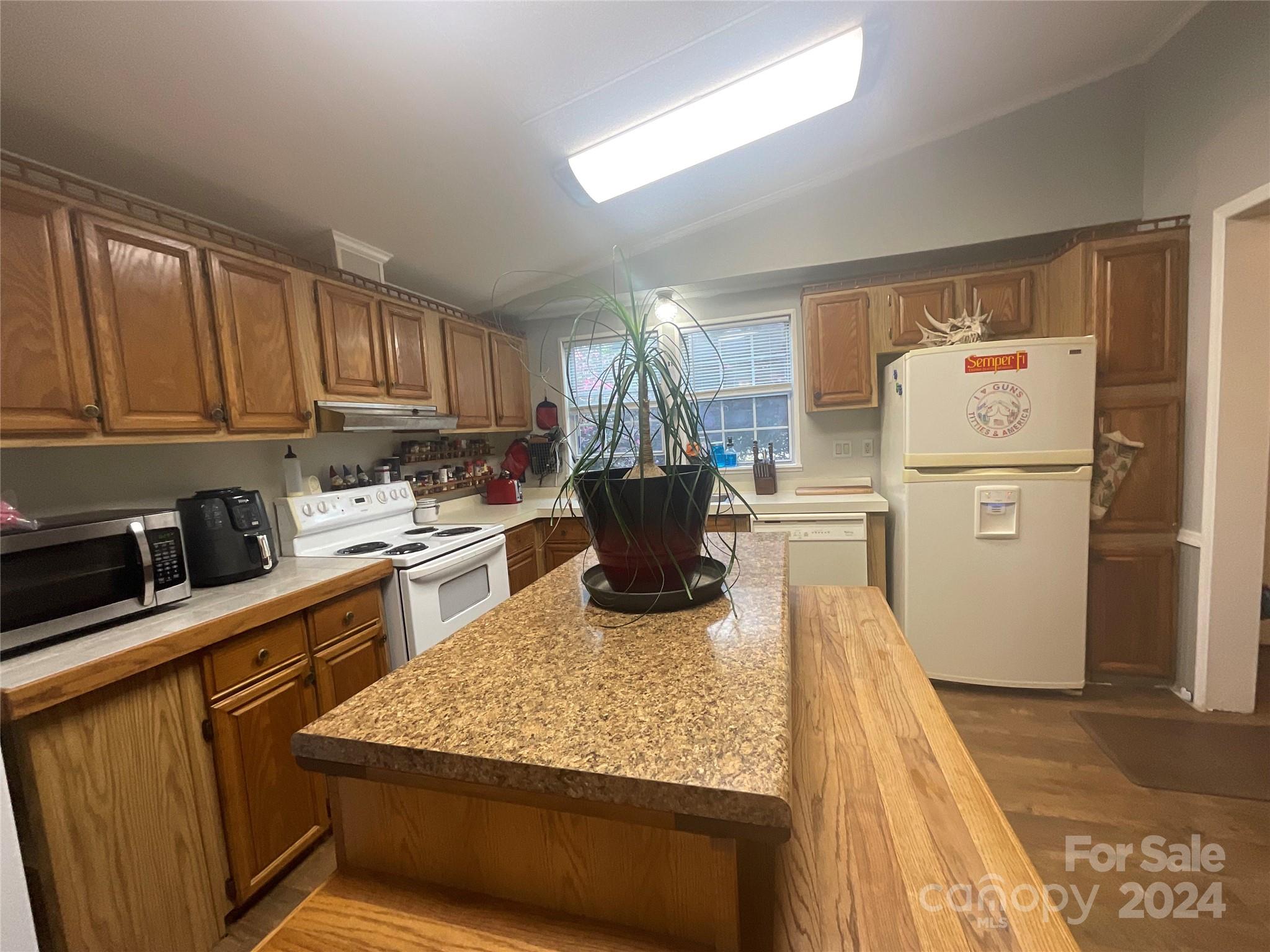 900 Jim Elliott Road Shelby, NC 28150 - Photo 13 of 29 a kitchen with refrigerator stove and a sink