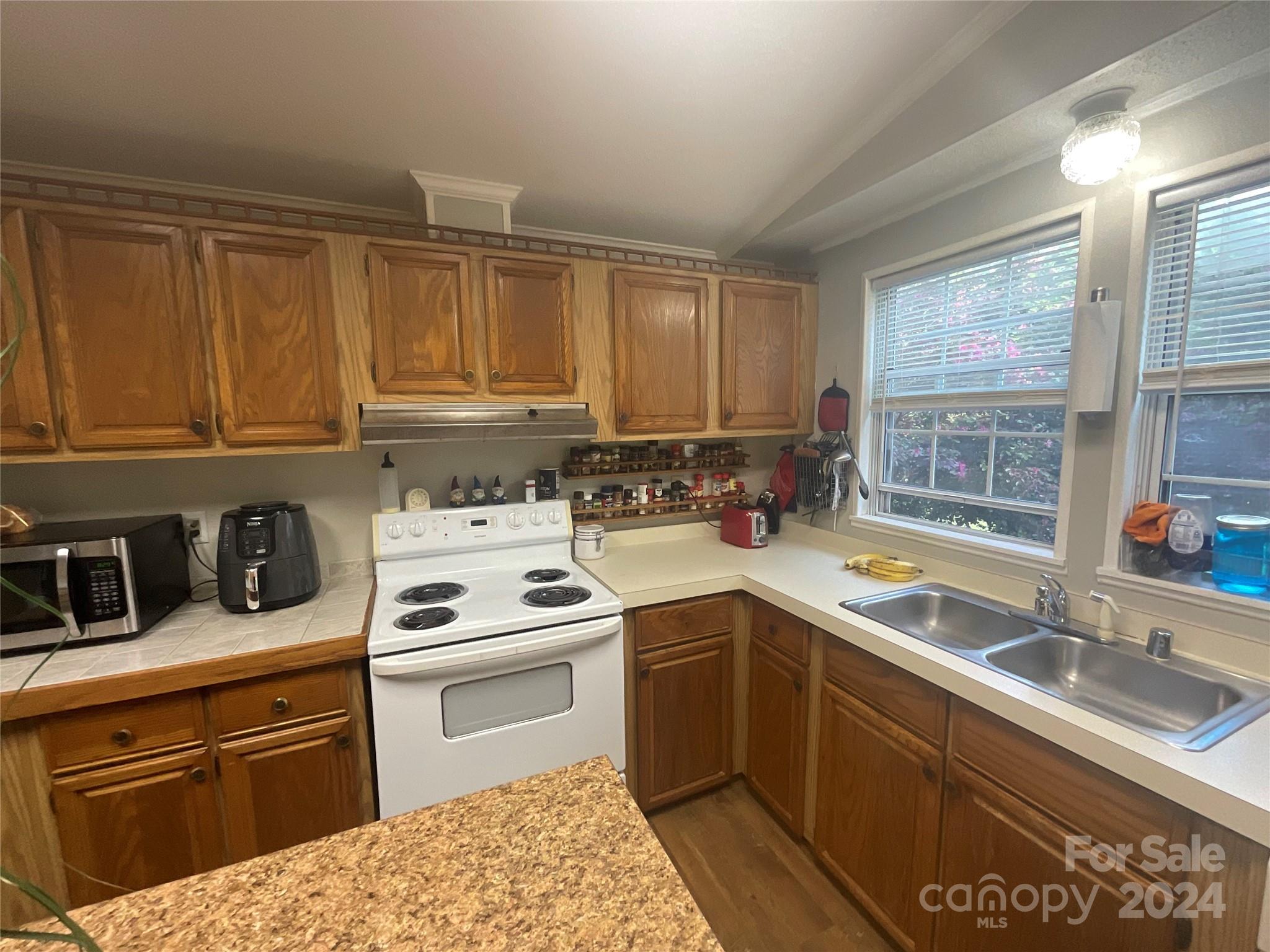 900 Jim Elliott Road Shelby, NC 28150 - Photo 14 of 29 a kitchen with a sink stove top oven and cabinets