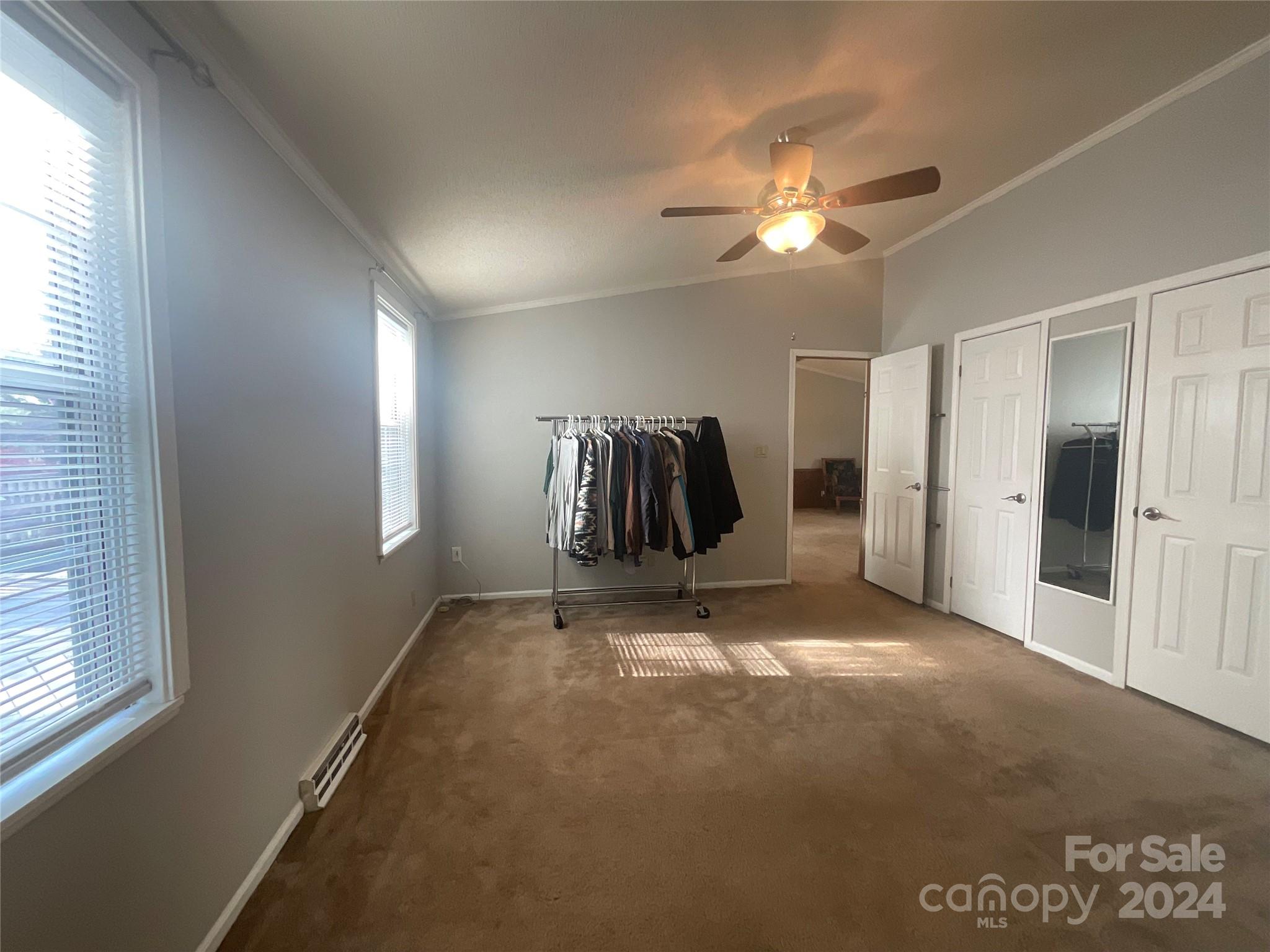 900 Jim Elliott Road Shelby, NC 28150 - Photo 19 of 29 a view of an empty room with window and chandelier fan