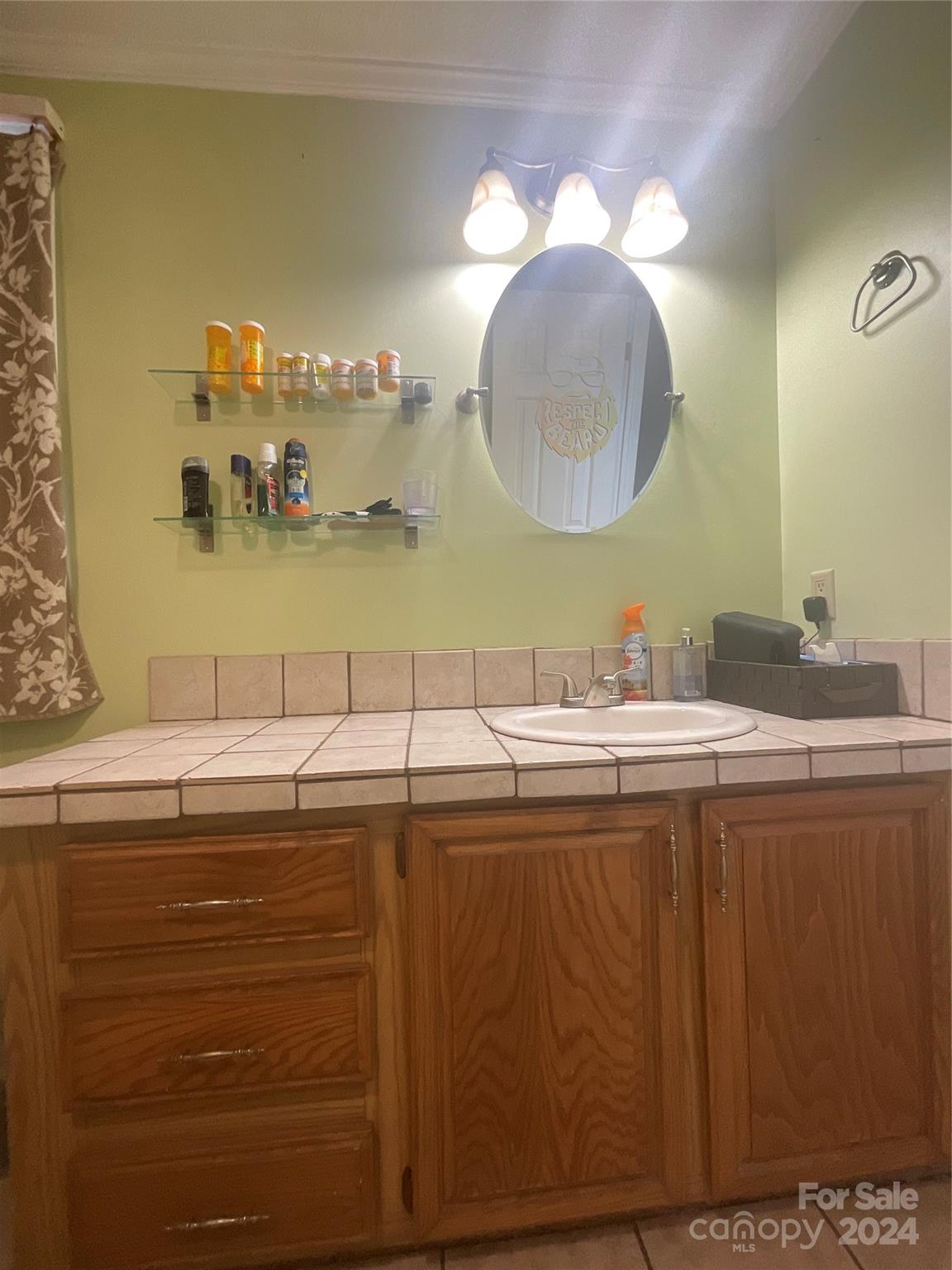 900 Jim Elliott Road Shelby, NC 28150 - Photo 21 of 29 a bathroom with a sink mirror and vanity