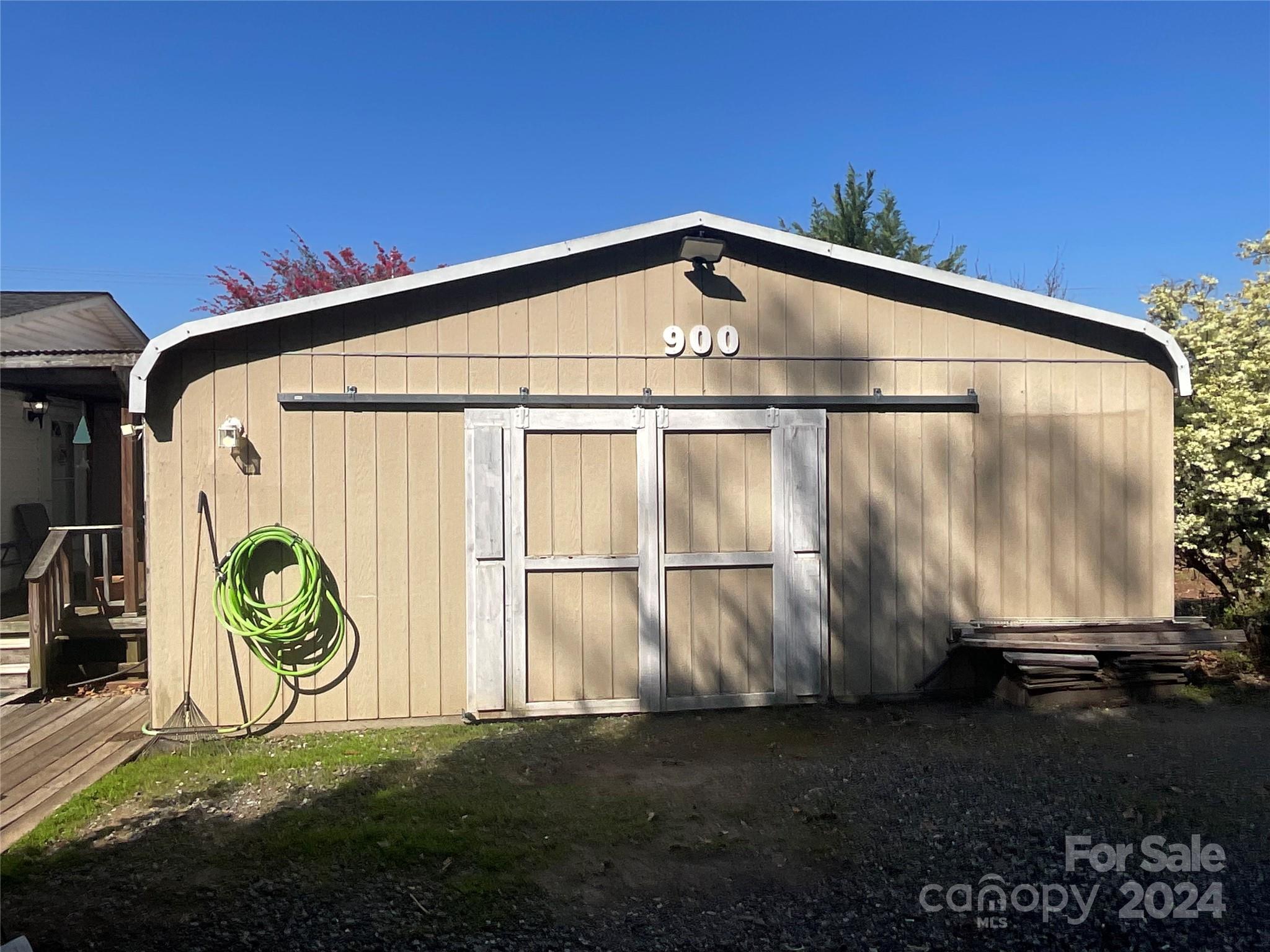 900 Jim Elliott Road Shelby, NC 28150 - Photo 25 of 29 a blue sign that is on the side of the road