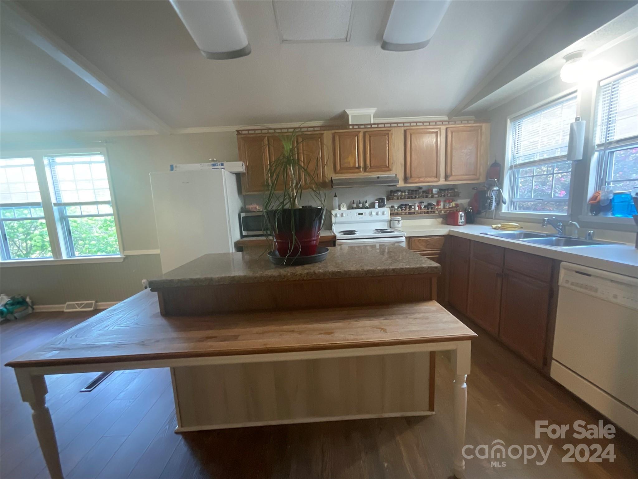 900 Jim Elliott Road Shelby, NC 28150 - Photo 9 of 29 a living room with stainless steel appliances granite countertop a sink dishwasher stove and microwave with wooden floor
