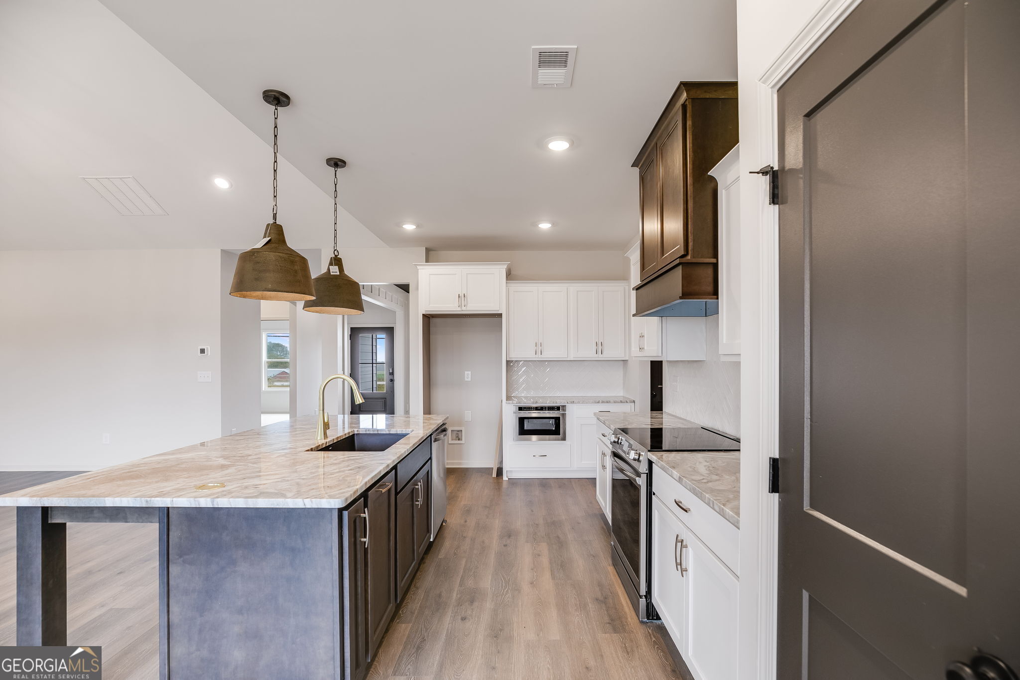 12 Stewart Road Roopville, GA 30170 - Photo 14 of 48 a kitchen with kitchen island a counter top space a sink stainless steel appliances and cabinets