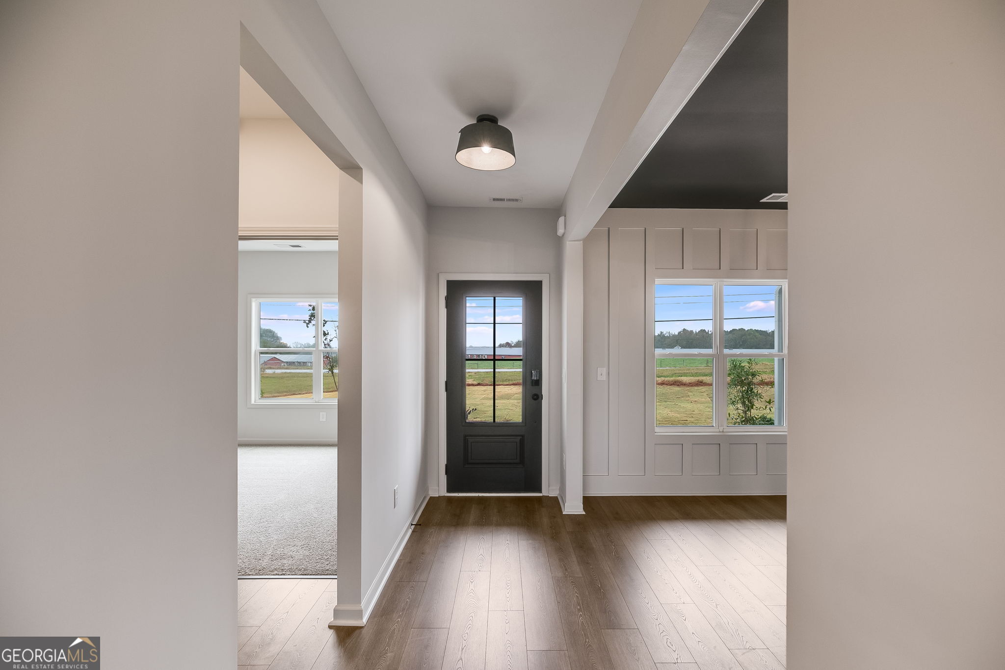 12 Stewart Road Roopville, GA 30170 - Photo 17 of 48 an empty room with wooden floor and windows