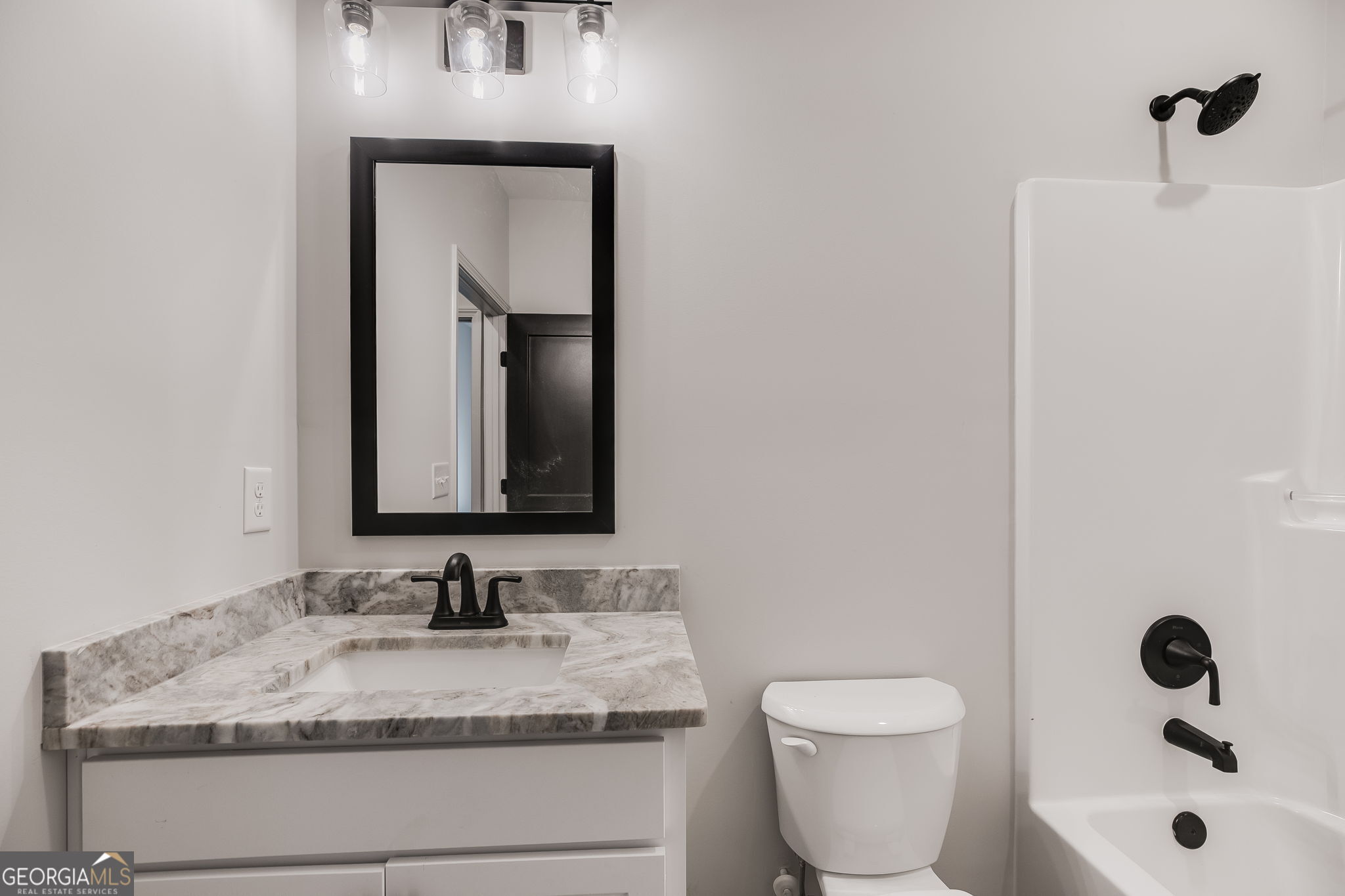 12 Stewart Road Roopville, GA 30170 - Photo 29 of 48 a bathroom with a granite countertop sink toilet and mirror