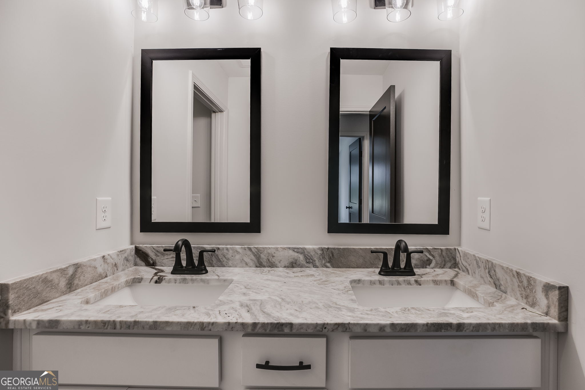 12 Stewart Road Roopville, GA 30170 - Photo 33 of 48 a bathroom with double vanity sinks and a mirror