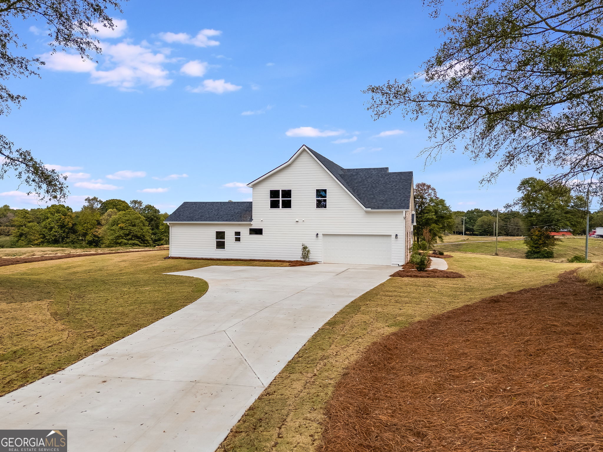 12 Stewart Road Roopville, GA 30170 - Photo 48 of 48 a view of a white house with a yard and a large tree