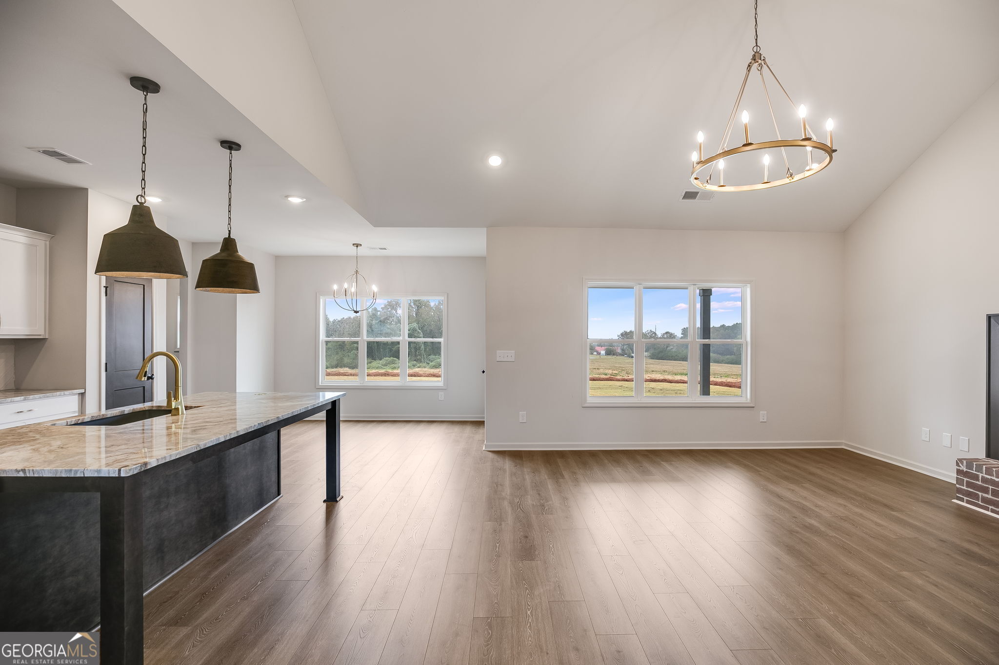 12 Stewart Road Roopville, GA 30170 - Photo 10 of 48 a large kitchen with granite countertop a large window a sink and stainless steel appliances