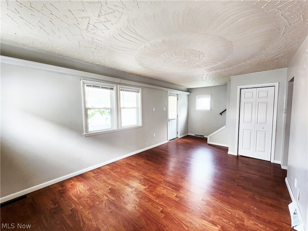 30 West Wilbeth Road, Unit A Akron, OH 44301 - Photo 2 of 16 Empty room featuring hardwood / wood-style floors and a wealth of natural light