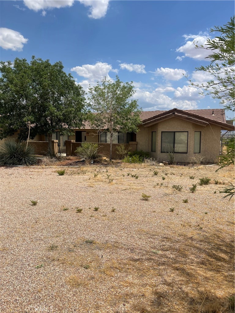 23859 Papago Road Apple Valley, CA 92307 - Photo 2 of 32 a view of house with snow on the road
