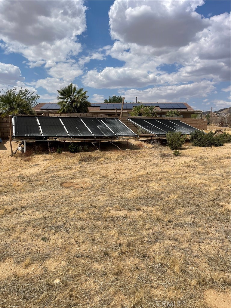23859 Papago Road Apple Valley, CA 92307 - Photo 24 of 32 a view of a yard with an outdoor space