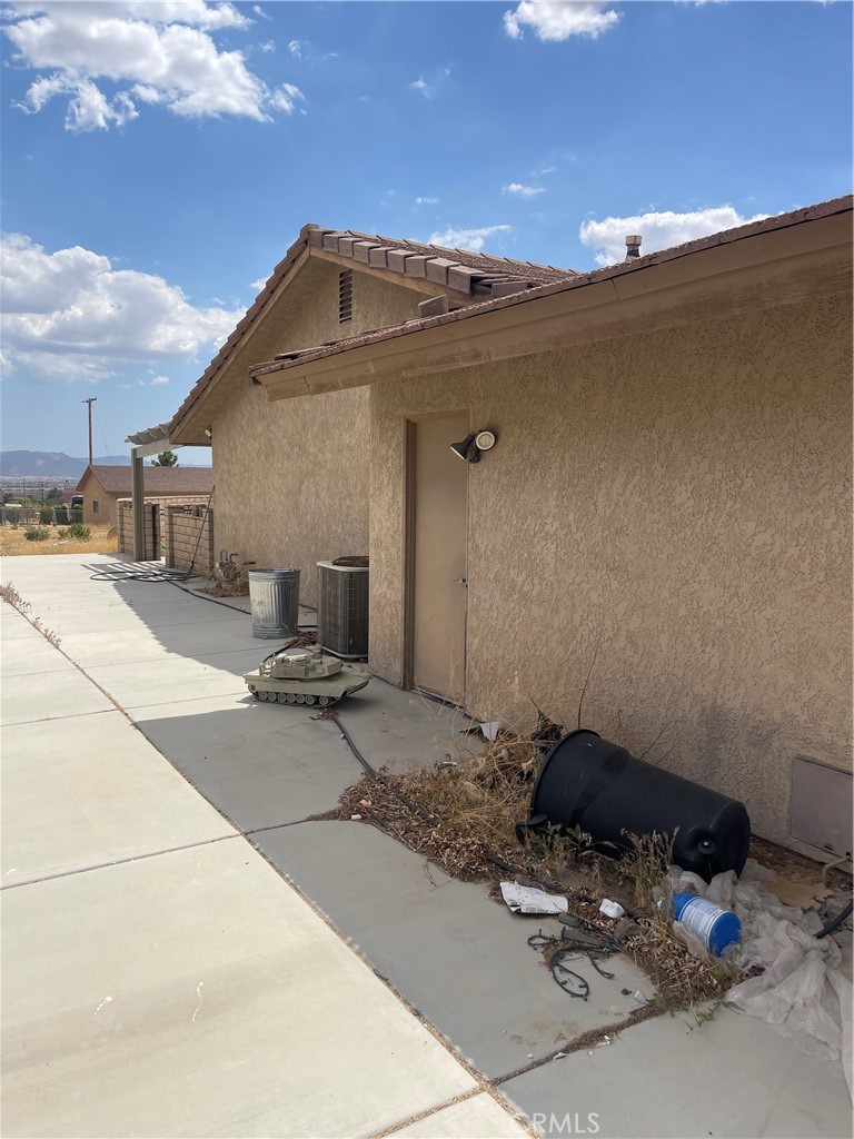23859 Papago Road Apple Valley, CA 92307 - Photo 4 of 32 a roof deck with table and chairs with wooden floor