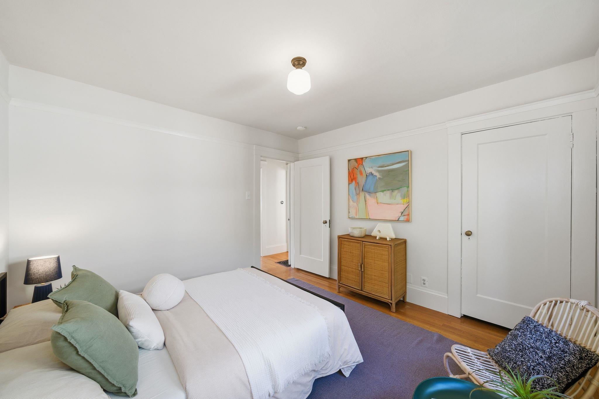 2401 Carleton Street Berkeley, CA 94704 - Photo 20 of 46 Bedroom featuring wood finished floors and baseboards