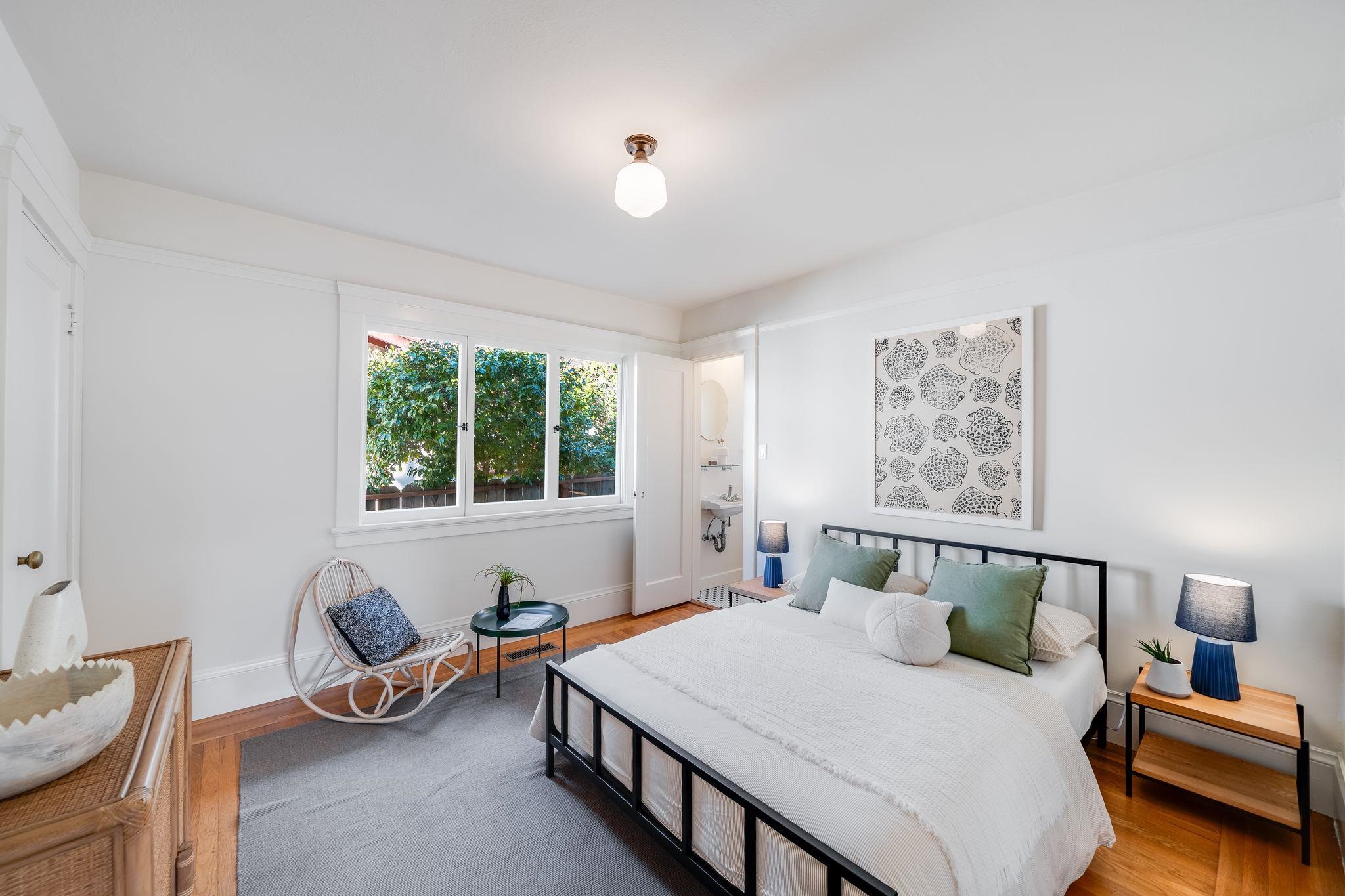 2401 Carleton Street Berkeley, CA 94704 - Photo 21 of 46 Bedroom featuring wood finished floors and baseboards
