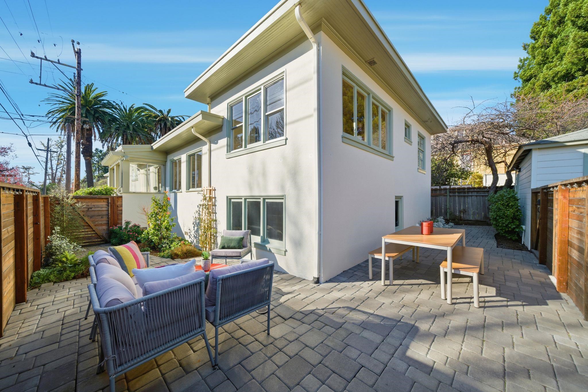 2401 Carleton Street Berkeley, CA 94704 - Photo 33 of 46 Fenced backyard with an outdoor hangout area, outdoor dining area, and a patio area