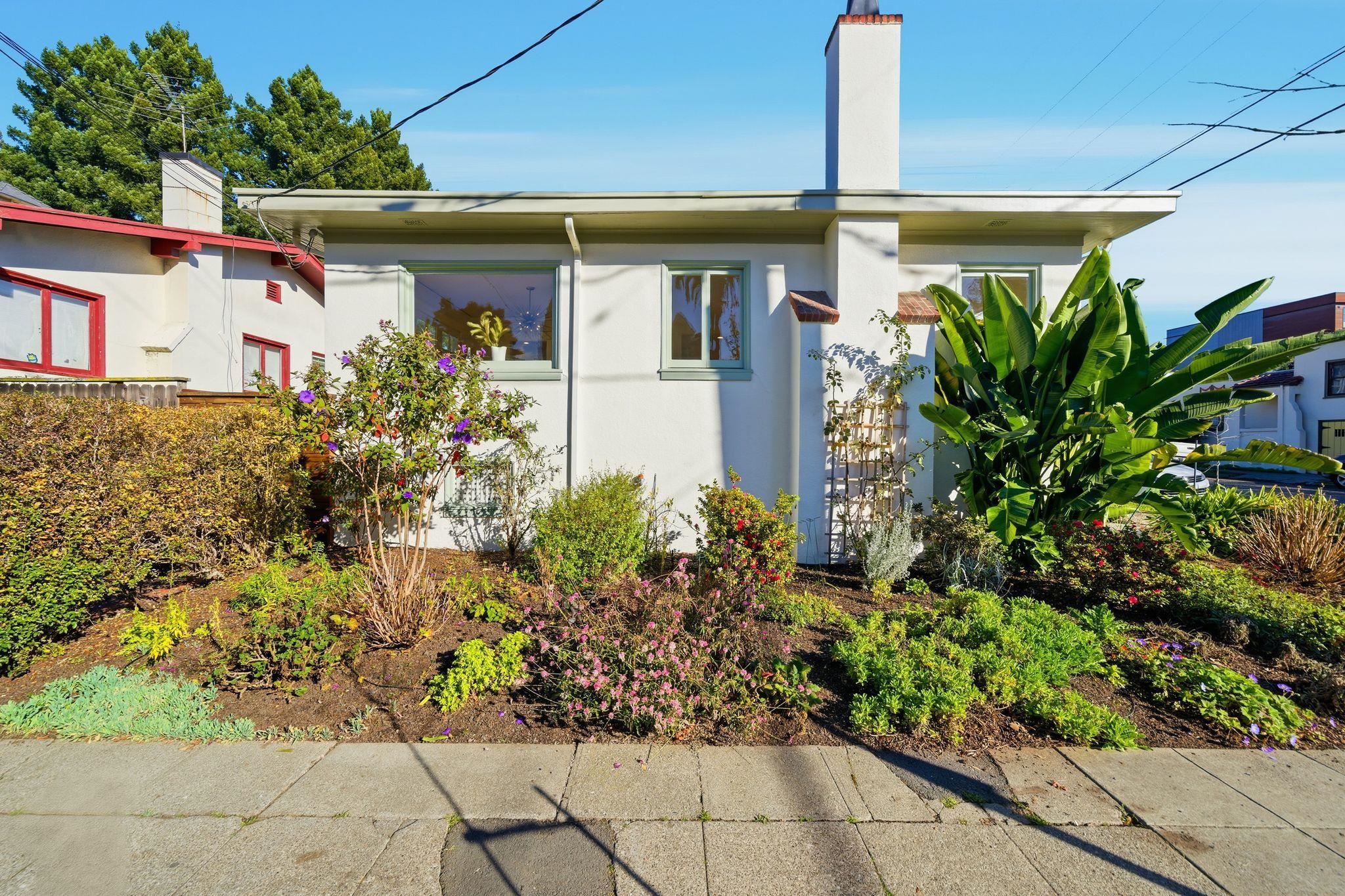 2401 Carleton Street Berkeley, CA 94704 - Photo 37 of 46 View of property exterior featuring a chimney and stucco siding