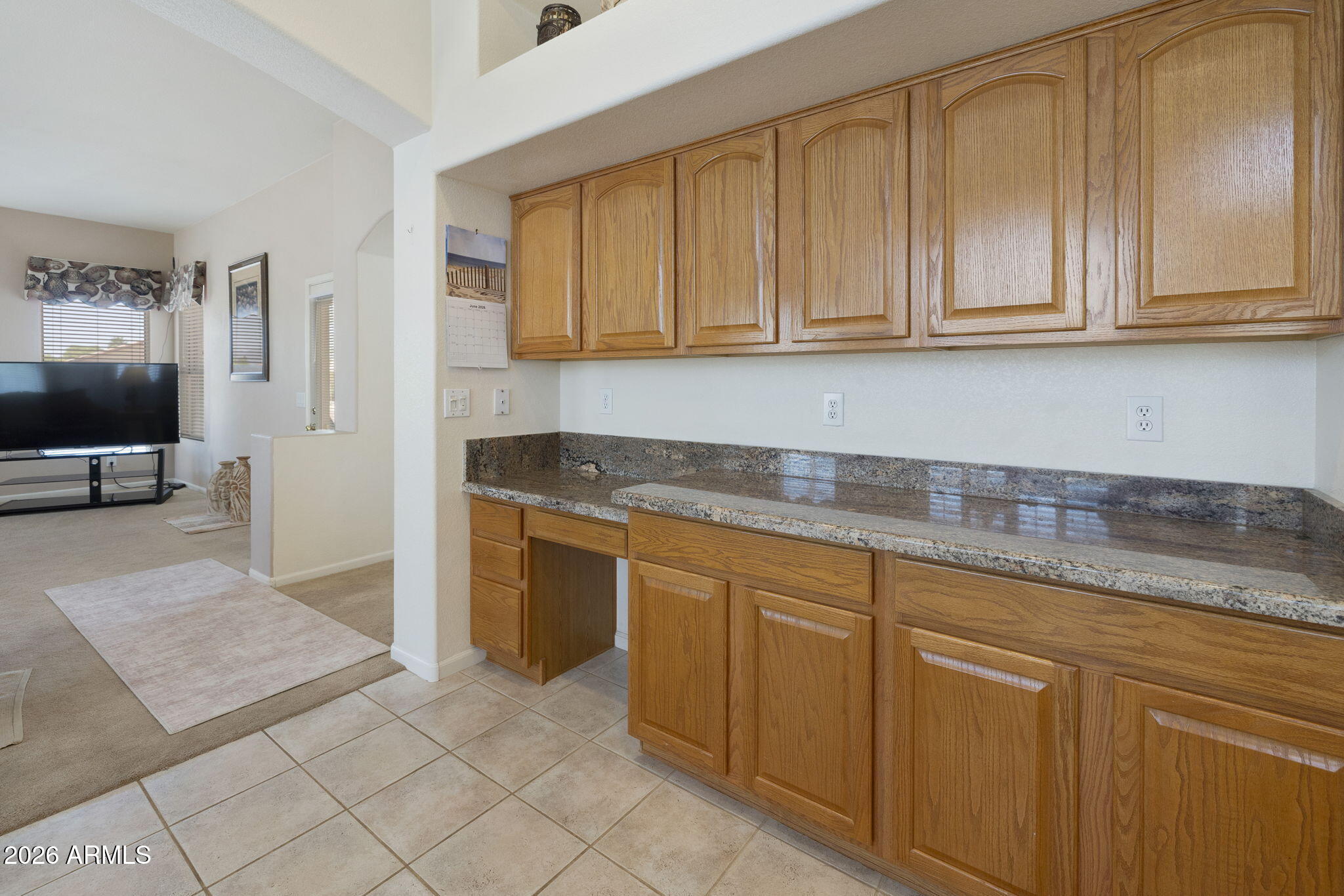12435 West Monte Vista Road Avondale, AZ 85392 - Photo 24 of 69 a kitchen with granite countertop white cabinets and sink